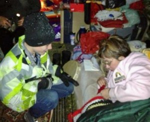 Wes Prankard, a Niagara Falls, Ontario resident and young advocate for Native Peoples, guves a necklace to Chief Theresa Spence on day eleven of her hunger strike in Ottawa.