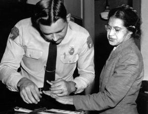 Rosa Parks, being arrested and booked, for refusing to give up her seat on a bus