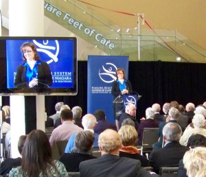 Gloria Kane, the NHS chief planner and one of those primarily responsible for locating this new, state-f-the-art hospital in this stupid site, receives a warm welcome from the St. Catharines elite at any rate. Photo by Doug Draper