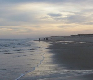 Last peaceful walk on a beach before the scandals and madness of a world inland from here washes back in. Photo by Doug Draper