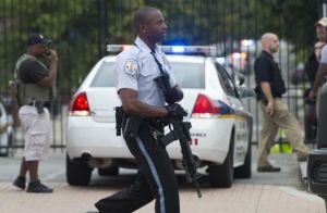 An American police officer runs to latest mass shooting incident in that country.