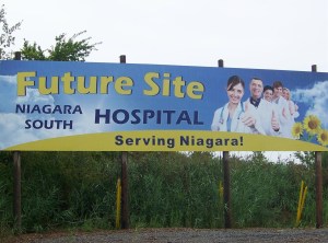 A billborad already up for a new hospital off Lyons Creek and Montrose Roads in a west corner of Niagara Falls, to serve the resident of south Niagara. Ontario PC Leader Tim Hudak was there, pushing the Liberal government to build it there, as soon as possible. Photo by Doug Draper