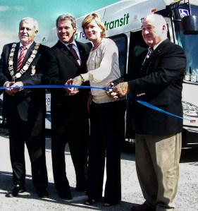 Niagara Regional Chair Gary Burroughs, Port Colborne Mayor Vance Badawey, Grimsy Regional Councillor Debbie Zimmerman and St. Catharines Regional Councillor Tim Ribgy, at ribbon cutting for Regional Transit service two years ago, and among the few on regional council who support a fuller regional transit system. File photo by Doug Draper