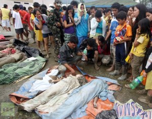 Severe weather deaths in the Phillipines as that countries climate change commissioner begs the world to 'end the madness'