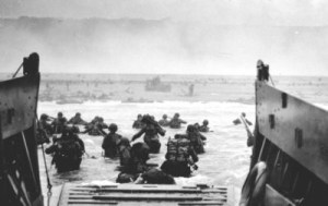 America troops land on Omaha Beach to wall of Nazi machine guns on D Day in June, 1944.