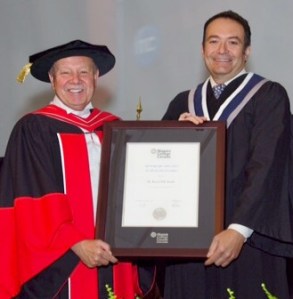 Niagara Health System CEO at Niagara College graduation ceremnies with college's president Dan Patterson after being awarded an hnourary diploma.