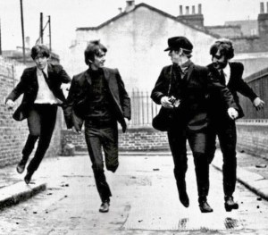 Young and energetic Beatles on the run in a scene from A Hard Day's Night