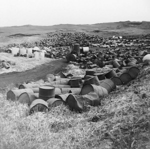 A historic photo of barrels of toxic chemicals to be buried at the Love Canal site before a school and heibhourhoood homes were later built around and on top.
