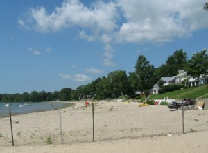 This fence, installed by private homeowners right down to the waterline of Lake Erie in Fort Erie, Ontario, says to public beach walkers; 'Do your walking somewhere else.'