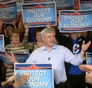 Surrounded by party supporters, a re-charged Stephen Harper pulls a surprise surplus out of the hat
