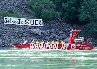 A citizens group along the lower Niagara River shows their opposition to the river being used by jet boats. File photo