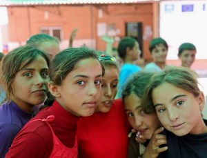 Syrian children and their families wait in refugee camps while they seek a new home away from the death and destruction in their homeland