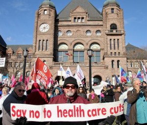 This 2014 rally on the lawns of Queen's Park in Toronto is one of many in recent years organized by the Ontario Health Coalition and other public interest organizations in support of quality, public health care.
