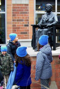 Children look up at a statue of Harriet Tubman unveiled February 9th, 2016 at a St. Catharines school named after her.