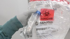 Brock University researcher Darrell Agbulos unpacks vials of the Zika virus in Brock's CL3 Containment lab.