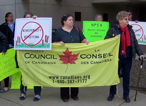 Fiona McMurran and Marie Hekkert, members of the Niagara South chaper of the Council of Canadians, show their support for saving wetlands at Niagara regional headquarters this April 7th