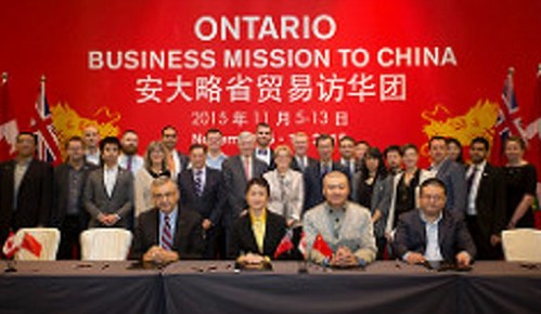 Ontario Premier Kathleen Wynne in the second row, in China last November 2016, cutting business deals with numerous other Chinese and Ontario corporate reps on hand.
