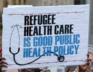 Health care providers and supporters hold a rally to protest federal cuts to refugee care on Parliament Hill in Ottawa, Monday, June 16, 2014. (Sean Kilpatrick/CP)