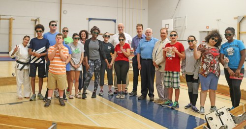 A group of campers from the Autism Spectrum Disorder Summer Movement Camp at Brock University pose with officials from Brock, the Region of Niagara and Niagara Recycling, which has funded the camp for the past 20 years.