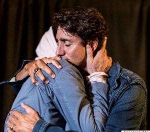 Prime Minister Justin Trudeau gives a hug of support to Gord Downie before the Hip takes the stage in Kingston this August 20th