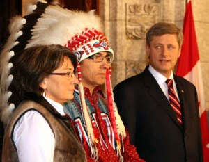 (080612) -- OTTAWA, June 12, 2008 (Xinhua) -- Canadian Prime Minister Stephen Harper (R) and Assembly of First Nations Chief Phil Fontaine (C) attend a news conference on Parliament Hill in Ottawa, Canada, June 11, 2008. Stephen Harper delivered an official apology Wednesday for thousands of aboriginal victims of residential schools in history. Residential school survivors and native representatives, some wearing traditional clothing, attended the apology ceremony. From the 1870s to the 1970s, about 150,000 aboriginal children were forcibly removed from their parents and sent to distant residential schools in a bid to assimilate them into Christian society. Many say they were abused mentally, physically and sexually at the schools. (Xinhua/Gao Rudong) (lyx/lhn)