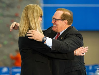 Former Canadian Olympic Committee President Marcel Aubut, who as forced to resign because of sexual harassment complaints, is about to embrace Canadian Paralympic Committee CEO Karen O'Neill.