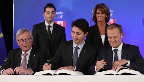 Prime Minister Justin Trudeau signs trade deal with his European Union counterparts. 