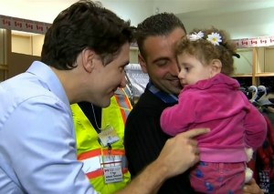 Canadian Prime Minister Justin Trudeau greets Syrian refugees arriving at Toronto airport last year.