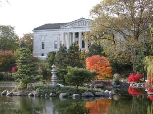 The Buffalo History Museum, overlooking a pond and the south end of the city's scenic Delaware Park.
