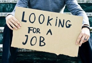 young-businessman-holding-sign-looking-for-a-job
